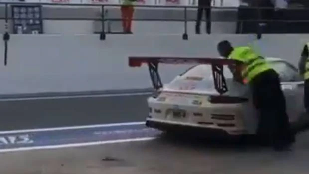 Watch: Race crew member shoves rival into path of car - Driven Car Guide