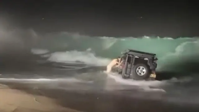 Watch: Land Rover is pummelled by waves after getting bogged - Driven ...