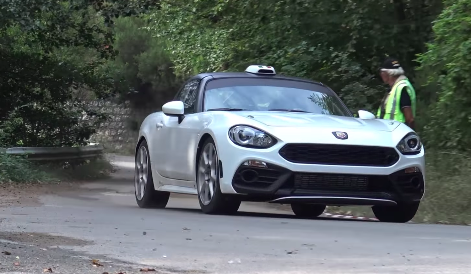 Watch the Abarth 124 Rally R-GT pop, slide, and bang - Driven Car Guide