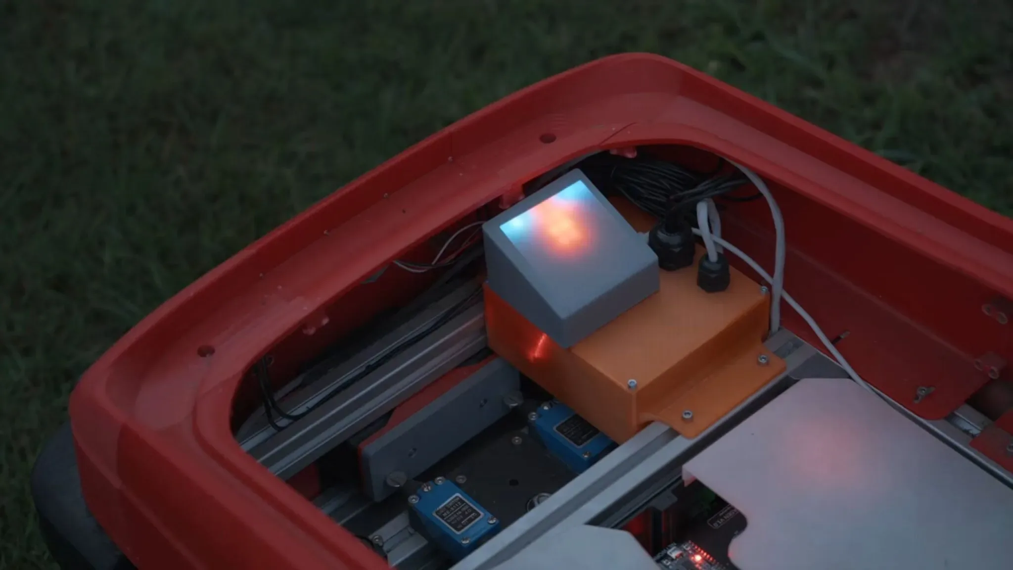 Mower cutting disc beneath the bonnet