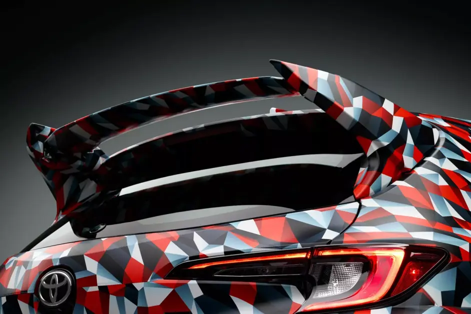 Prototype shows vents, wing, and revised chassis tuning.