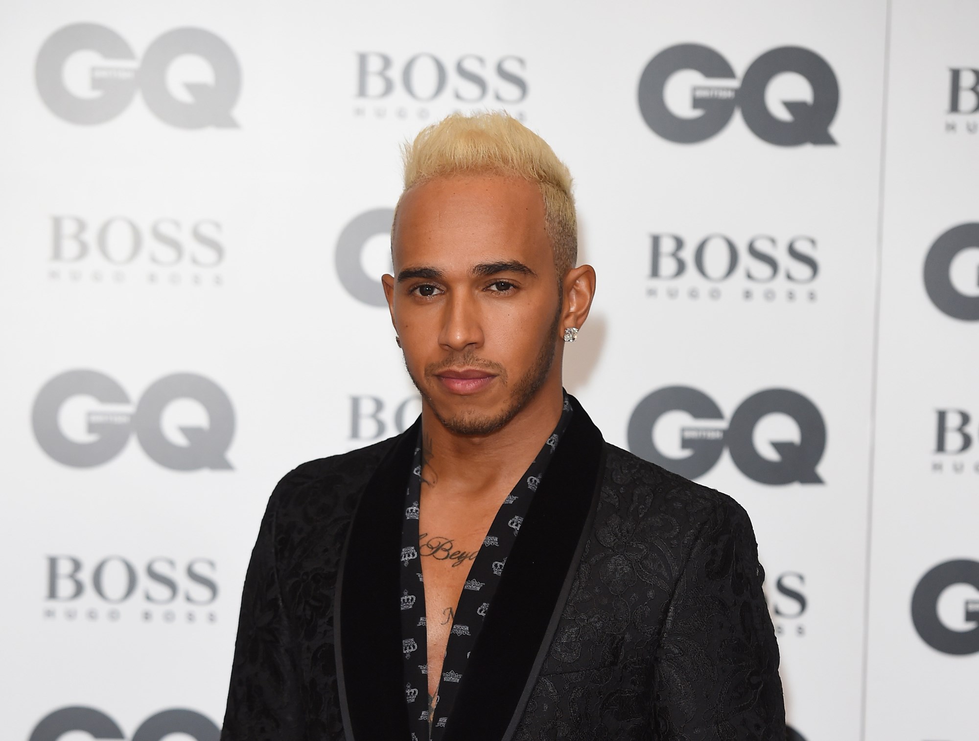 A blond Lewis Hamilton steps out - Driven Car Guide