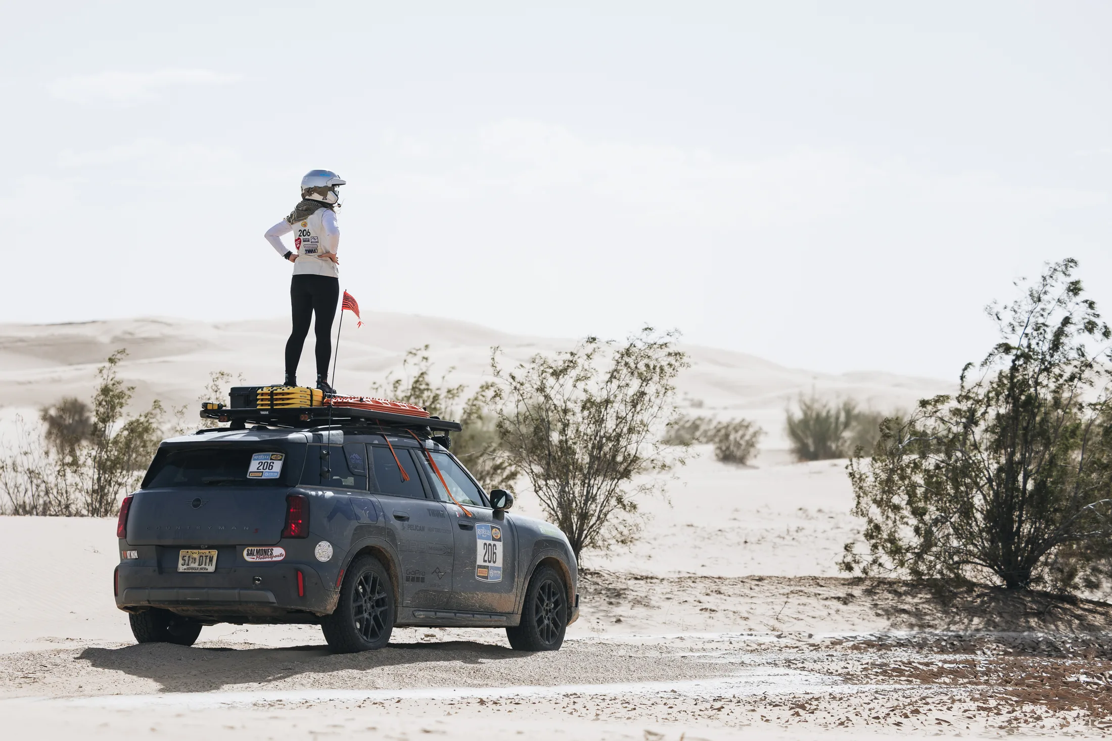 Rally crew member surveying the route from the Countryman.