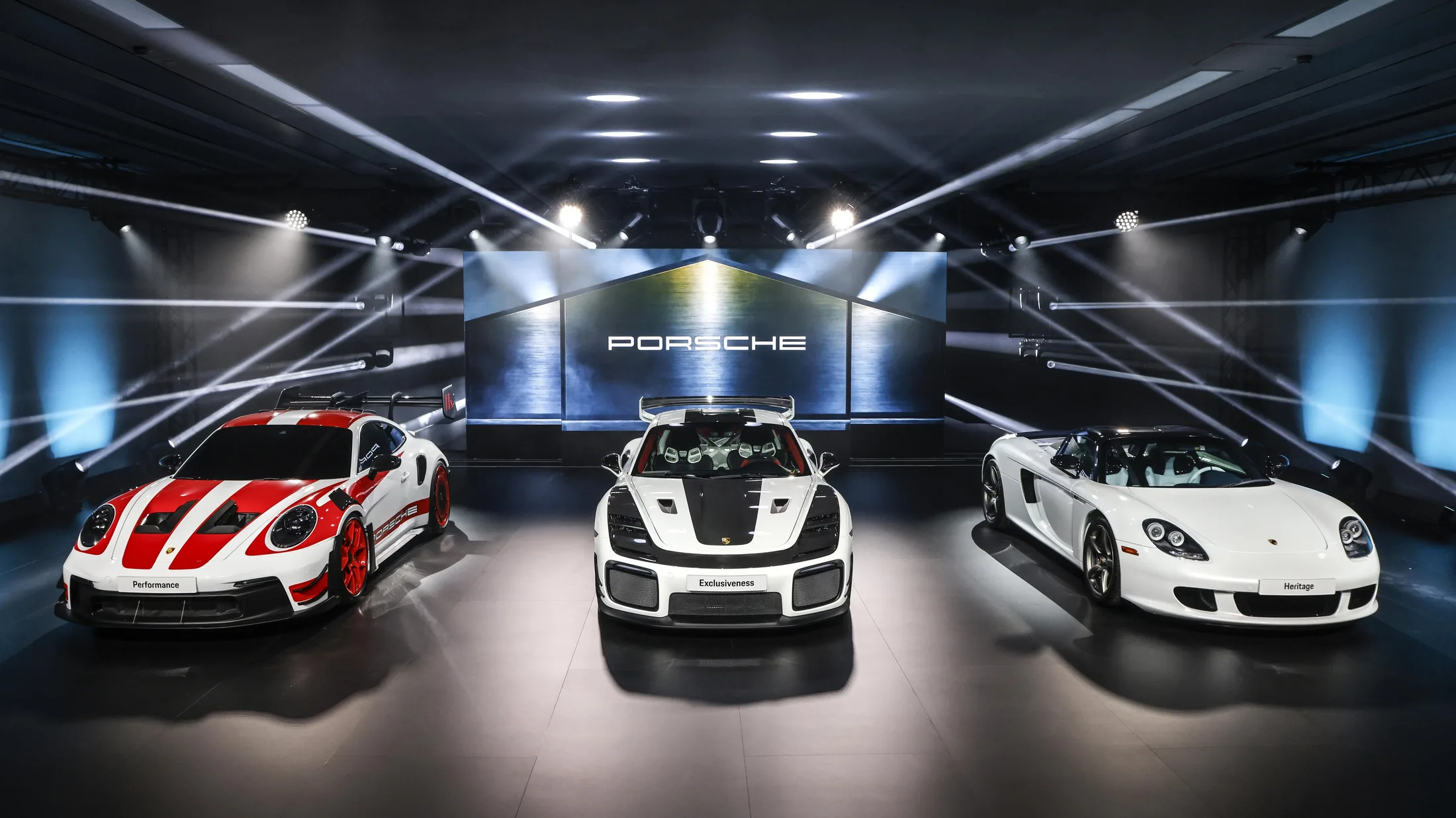 Porsche and Manthey cars at a presentation