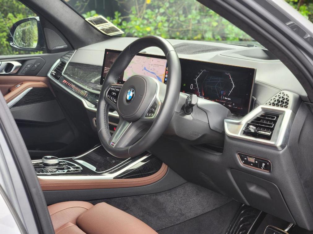 The BMW X7's interior is packed with tech and extremely luxurious. The brown leather is optional...