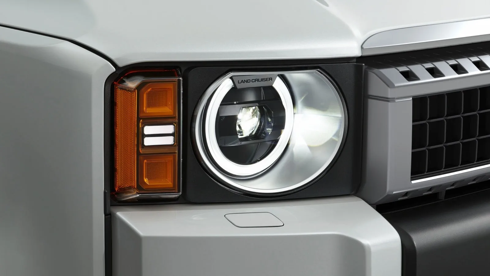 Official close-up illustration of the round-headlamp unit.