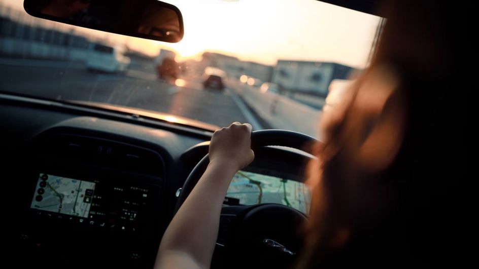 Driving on the road facing the sun